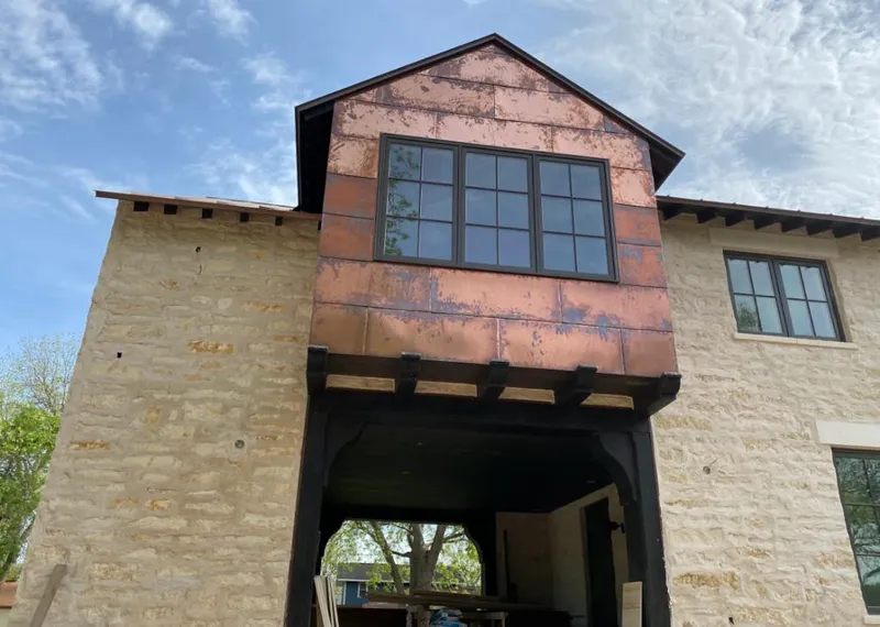 Copper metal panel facade on a stone building for Skylight Installation in Huntington Beach